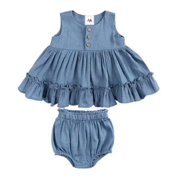Linen Ruffle Dress Set - Blue Our adorable baby linen ruffle dress ser, the perfect addition to your little one's wardrobe! Made from high-quality linen, cotton materials, this dress set is both soft and comfortable for your baby's delicate skin, while also being breathable enough for everyday wear. Featuring a charming ruffle design, this romper is both stylish and cute, making it perfect for any occasion. Whether it's a family gathering or a day out with friends, your little one will look absolutely adorable in this set. This set features gorgeous wood buttons and matching bloomers for under the ruffle dress, making nappy changes easy. It can easily be layered with long sleeves and tights for cooler temperatures. Available in a variety of colors and sizes at Ash. The Label, our baby linen ruffle dress set is the perfect choice for parents who want to dress their little one in style and comfort. So why wait? Order yours today and give your baby the gift of style and comfort! Care 70% Cotton 30% Linen Gentle Machine wash in garment bag Warm Iron Warm tumble try